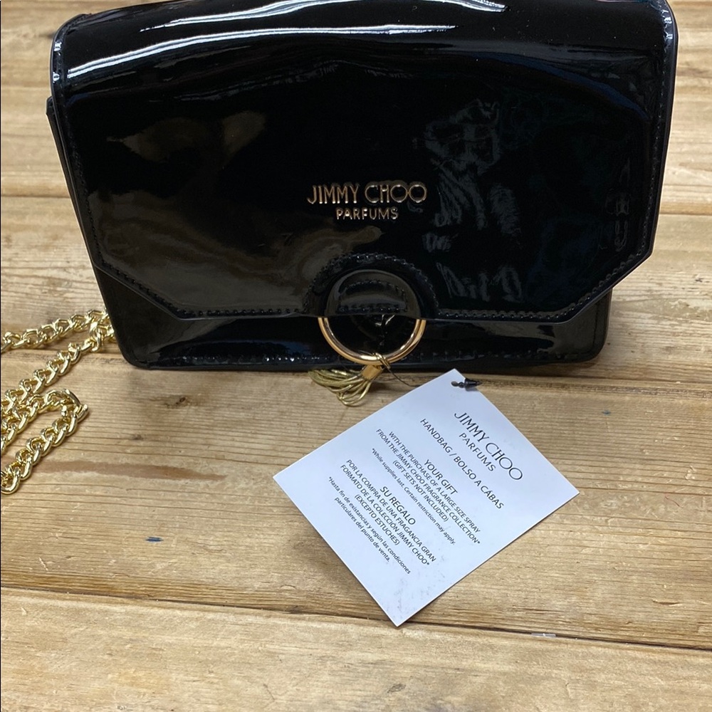Jimmy Choo Black and Gold Clutch with Zip Closure